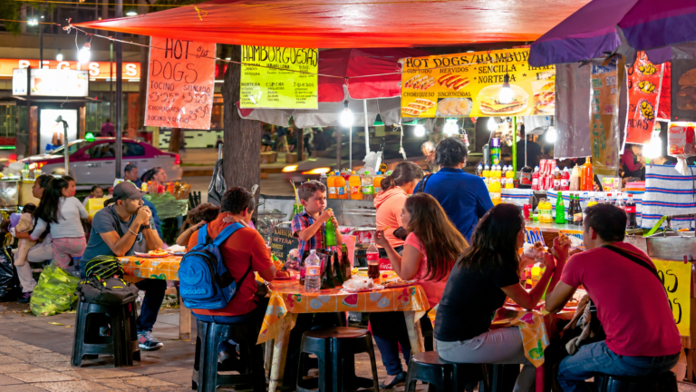 Mexico food scene with diners at a street restaurant in Mexico City