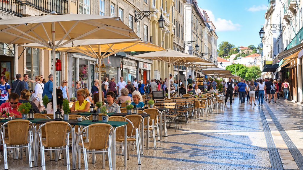 What to eat in Portugal – people dining at outdoor café tables in Lisbon