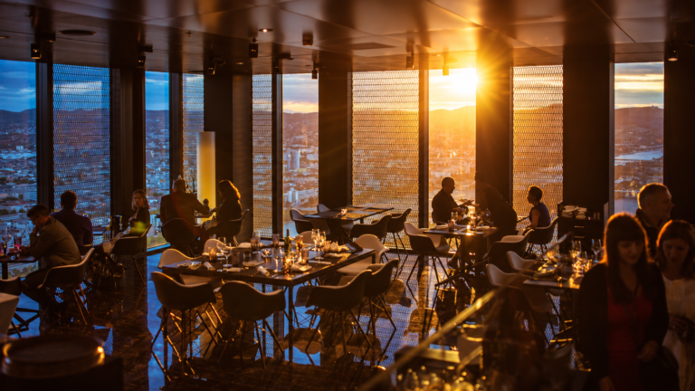 United Kingdom food guide with diners in an elegant restaurant at sunset